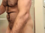 Hairy muscle bear flexing before shower!