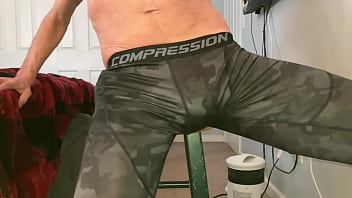 Stretching groin with Massage Balls on Stool in Compression Pants