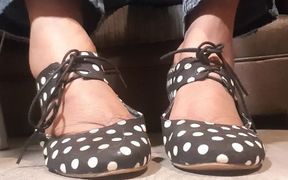 Polka dot shoes and very dirty feet