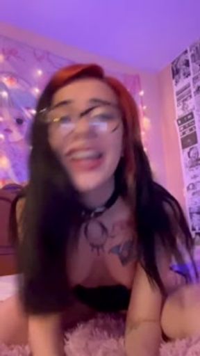 Sexy student smokes an electronic cigarette and shows pussy