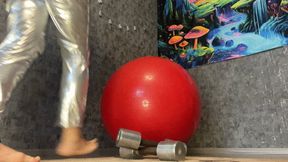 jumping on red gymball in silver costume