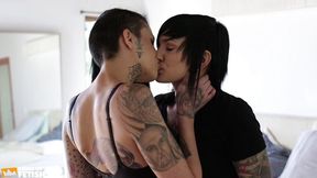 tattooed girl fucks her roommate wet cunt with a black strap on