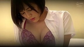 An office lady takes off her bra and masturbates by placing a vibrator over her pantyhose.