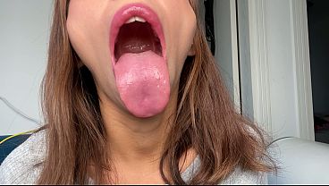 I show my wet long tongue with saliva
