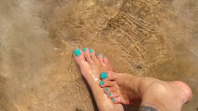 washing your feet in the soft water of the beach