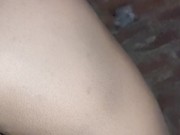 Feminized caged and pluged sissy shemale piss while walking on public