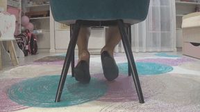 Deeping ballet flats under chair d