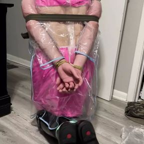 Vinyl skirt and top and clear plastic raincoat bondage