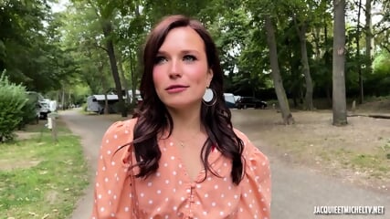 Oh, Oui! A stunning French brunette is seen passionately engaging in a steamy encounter in a public camper trailer park. The scene is filled with intense pleasure and excitement.