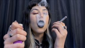 Deeply inhaling smoke in extreme close-ups