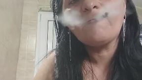 Smoking Mature Woman in Plaid Dress – Close-Up.