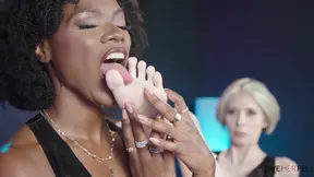 Ebony domme worships pale toes in glossy black latex for the ultimate foot fetish submission