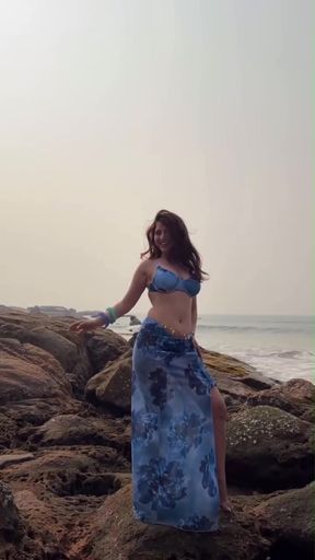 Indian babe shows off her swimsuit cleavage and desi tits in a bikini