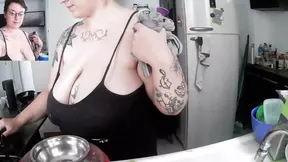 tattoed milf doing the dishes with too much cleavage