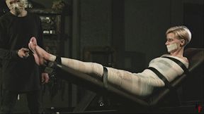 Bastinado and foot torment for Astrid in mummification (HD 720p MP4)