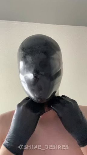 Pulling a condom over my shiny latex hood (Short)