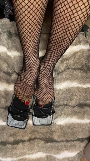 Fishnet in Open Toe Shoes with Red Nail Polish