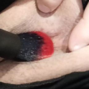 Tickling the clitoris with a brush