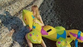 Alla inflates a rare inflatable dragon on the beach with her mouth!!!