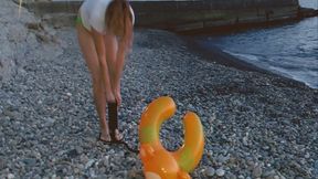 Alla found an abandoned inflatable ring on the beach and decided to destroy it with a hand pump!!!