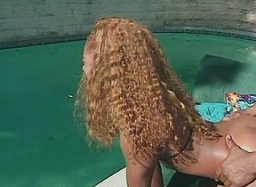 Big ass nubian chick is getting fucked near the pool