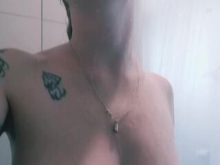 Natural blond shows off armpits in shower