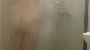 Redhead caught touching herself softly in the shower