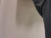 Femboy tries on women's blouse and skirt in store fitting room