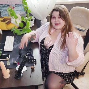 Russian Sex Shop Chubby Assistant Shows a Collection of Dildos and Anal Plugs