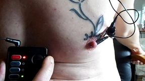 E-stim directly inside pierced nipple