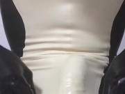 Handjob wearing latex catsuit with latex sheath inside