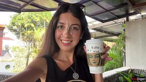 Skinny brown-haired amateur drinks coffee with seed on her face in public