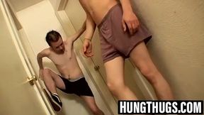 Billy and Damien stroke hard cocks in hallway