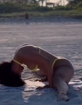 Ebony bikini babe shows off her ass