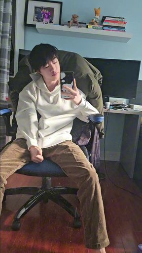 Asian boy taking selfie in front of mirror and secretly get hard