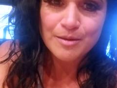 Busty curly brunette with big boobs fucks on couch