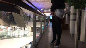 Crossdresser trying to bound himself to a handrail