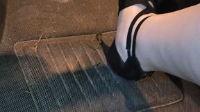 A POV stuck in the mud, watch my feet work the pedals in my heels trying to get my car unstuck!! Also has some shots of the wheels spinning, and some shots of my feet as I get out and try to push my car out as well!!