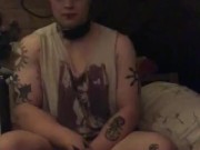 Leashed femboy queer girl sits obediently