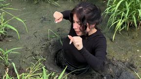 Sinking in swamp, exploring a swamp, a girl sinking in a swamp, a girl chest deep in a swamp, boots sinking in mud