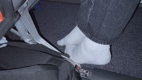 Amelie candidly filmed removing her sneakers onboard busy aircraft