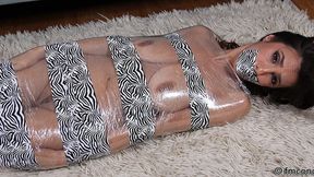 Slender But Busty Little Sophia Taylor Is Wrapped In Plastic That's Overlaid With Stylish Zebra-Pattern Tape!