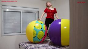 Alla does gymnastics with two huge inflatable beach balls