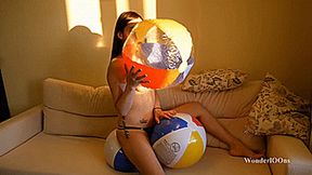 New girl inflates and pops beach balls 4K UHD