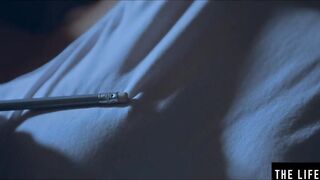 Rubbing her long puffy nipples as she fucks herself with
