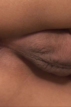A beautiful Asian woman comes back from a walk and relaxes by stroking his cock