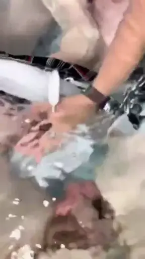 Hand job surprise in the hot tub with a busty neighbour