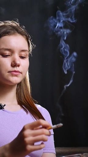 18 Aged Girl Is Smoking Two Strong Cork Cigarettes