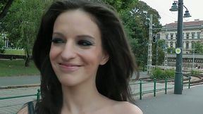 Ugly brunette is walking on a street