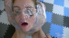 2 girls cellophane-wrapped for extreme facefuck + spit fun